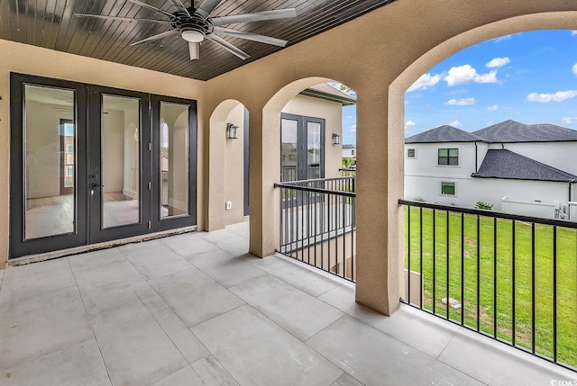 balcony featuring french doors and a ceiling fan