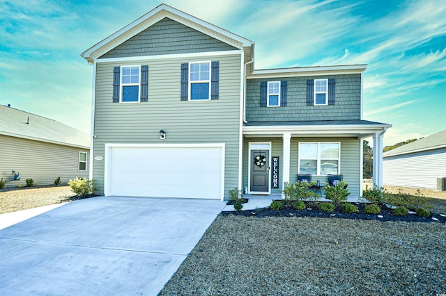 view of front of home featuring a porch and a garage