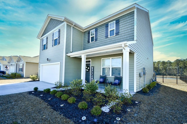 view of front facade featuring a porch and a garage