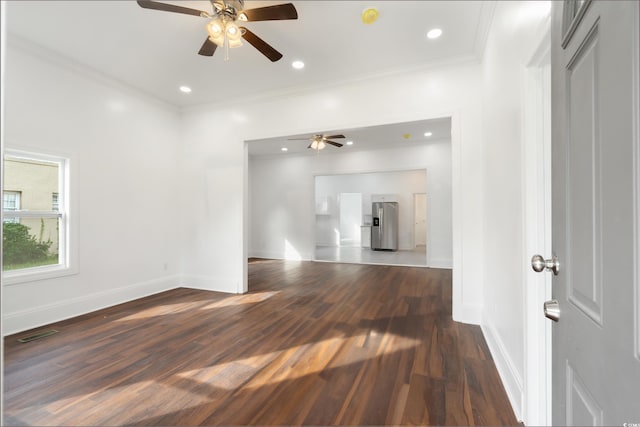 unfurnished living room with ornamental molding, ceiling fan, and dark hardwood / wood-style floors