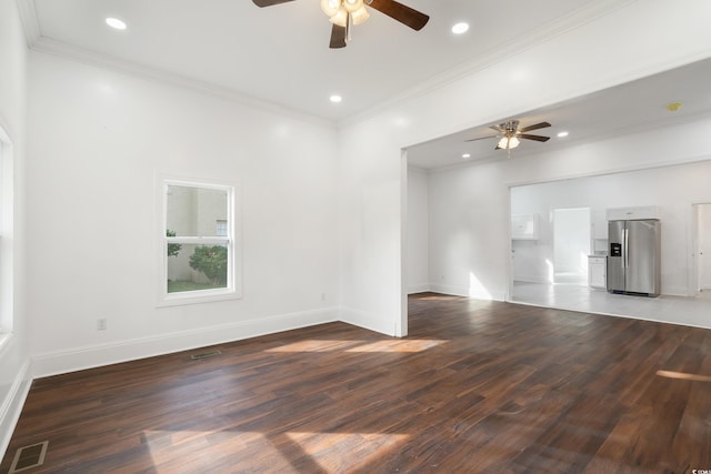 unfurnished living room with ceiling fan, crown molding, and dark wood-type flooring