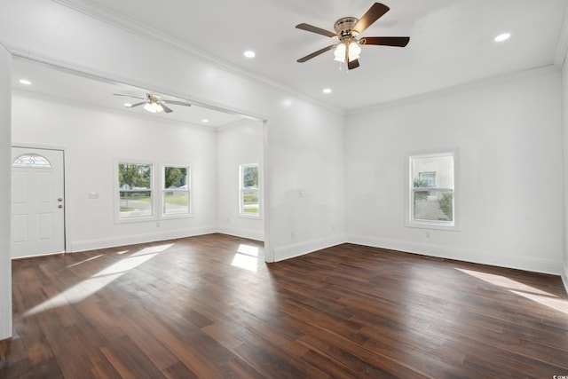 empty room with ornamental molding, ceiling fan, and dark wood-type flooring