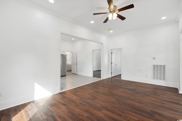 spare room with ceiling fan, dark hardwood / wood-style floors, and ornamental molding