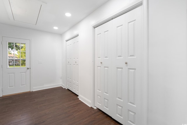 corridor with dark wood-type flooring