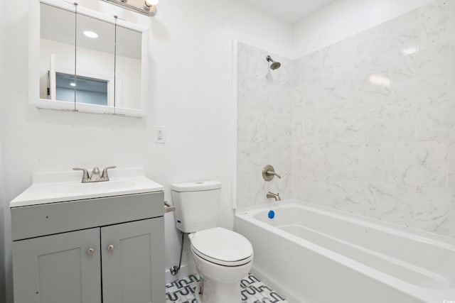 full bathroom with tiled shower / bath combo, vanity, toilet, and tile patterned floors