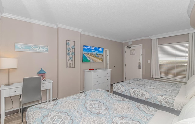 6900 N Ocean Blvd Unit 1040, Myrtle Beach, SC 29572 - bedroom featuring ornamental molding, a textured ceiling, and wood finished floors
