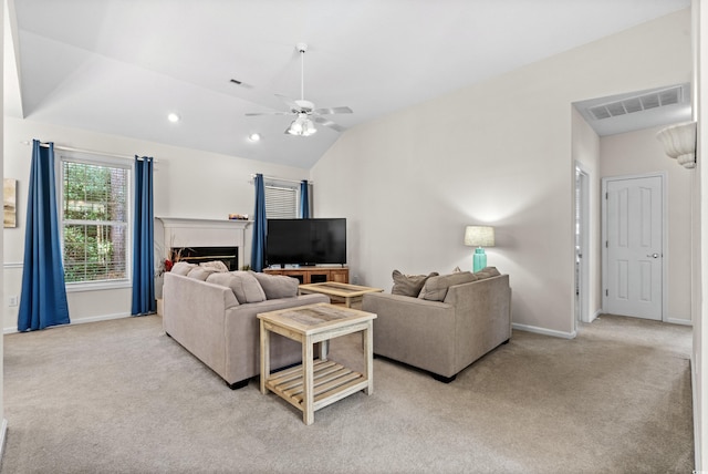 living room featuring ceiling fan, light colored carpet, and lofted ceiling