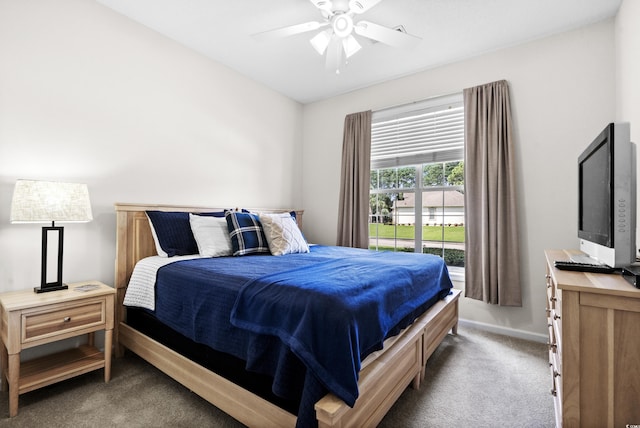 bedroom with dark carpet and ceiling fan