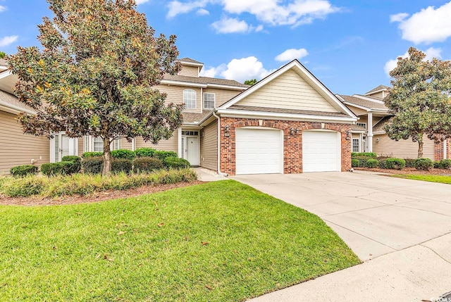 view of front of house featuring a front yard and a garage