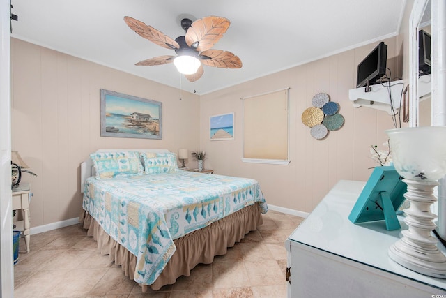 bedroom with ceiling fan, crown molding, light tile patterned floors, and wooden walls