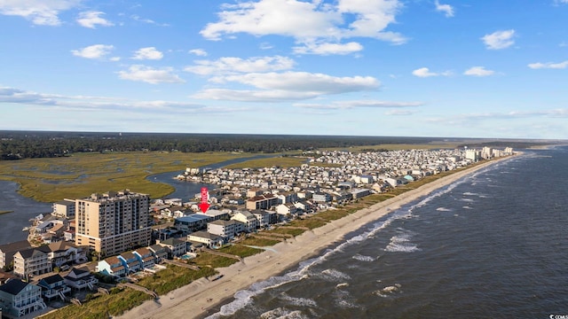 aerial view with a water view and a beach view