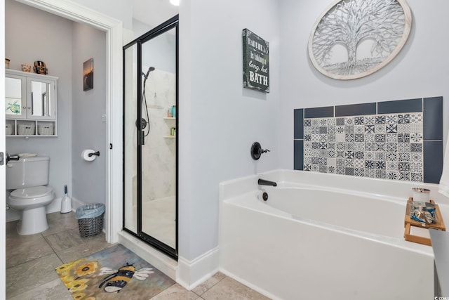 bathroom featuring tile patterned floors, toilet, and separate shower and tub