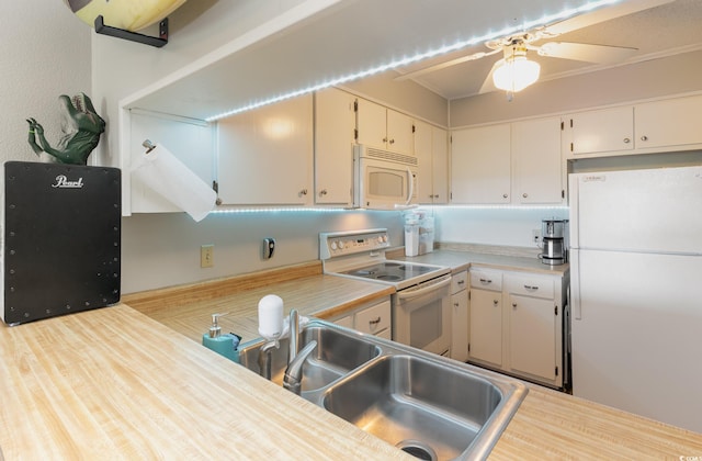 kitchen with light wood-type flooring, white appliances, sink, and ceiling fan