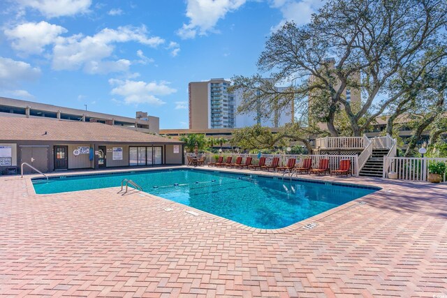 view of pool featuring a patio