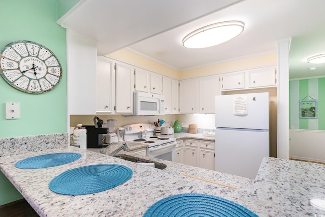 207 N Ocean Blvd Unit 241, North Myrtle Beach, SC 29582 - kitchen featuring white appliances, white cabinets, and crown molding