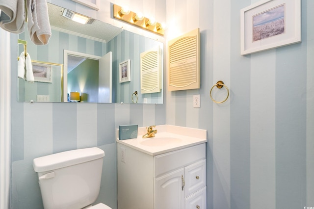 207 N Ocean Blvd Unit 241, North Myrtle Beach, SC 29582 - half bathroom featuring wallpapered walls, toilet, and vanity