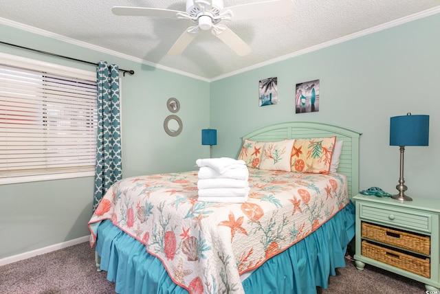 carpeted bedroom featuring a textured ceiling, ornamental molding, and ceiling fan