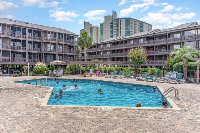 207 N Ocean Blvd Unit 241, North Myrtle Beach, SC 29582 - community pool with fence and a patio area
