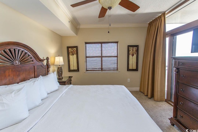 bedroom featuring a textured ceiling, ceiling fan, ornamental molding, and light carpet