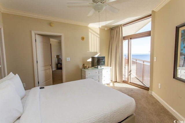 carpeted bedroom with access to exterior, ceiling fan, and crown molding