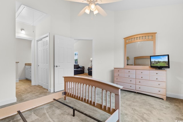 carpeted bedroom with a closet and ceiling fan