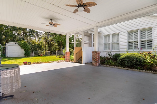 view of patio / terrace with ceiling fan and an outdoor structure