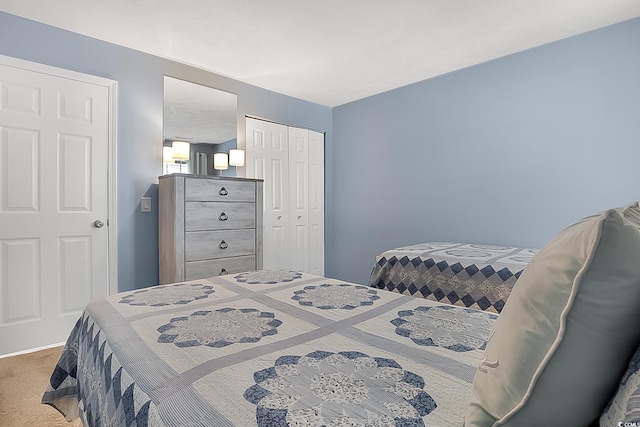 carpeted bedroom featuring a closet