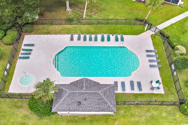 view of pool with a yard and a patio