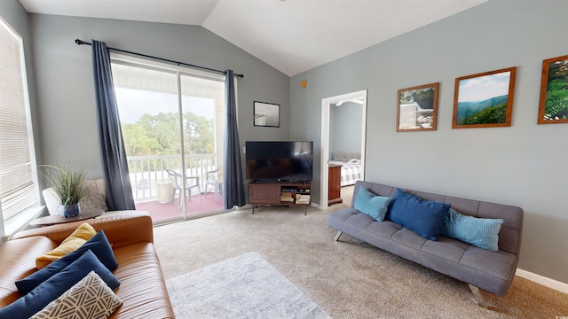 living room with carpet floors and vaulted ceiling