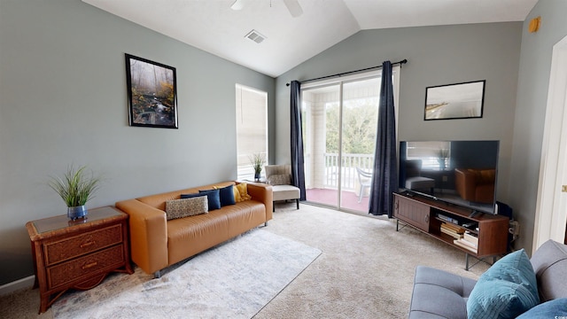 carpeted living room featuring ceiling fan and lofted ceiling