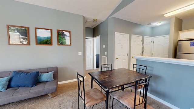 dining area with light carpet