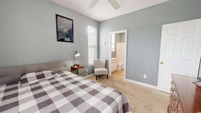 bedroom with light carpet, connected bathroom, and ceiling fan