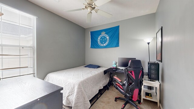 carpeted bedroom with ceiling fan