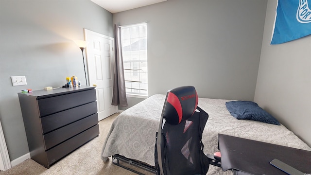 bedroom with light carpet