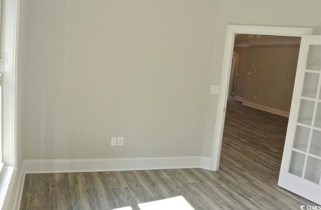 unfurnished room featuring hardwood / wood-style flooring