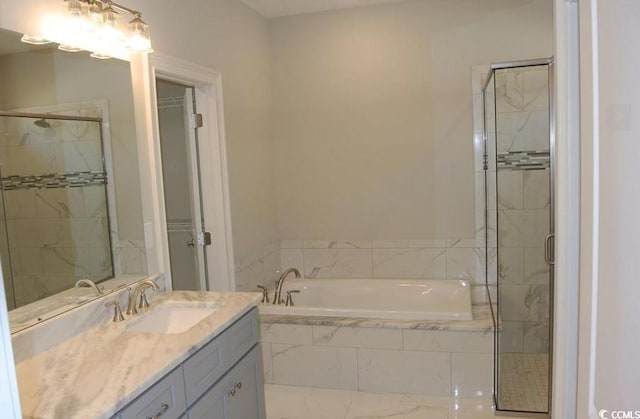 bathroom with vanity and plus walk in shower