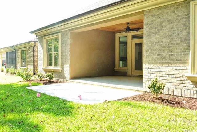 exterior space featuring ceiling fan, a yard, and a patio