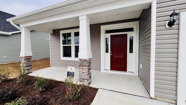 entrance to property with covered porch