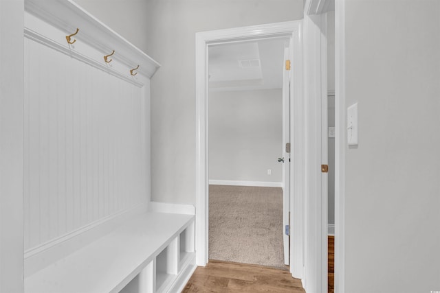 mudroom with light hardwood / wood-style flooring