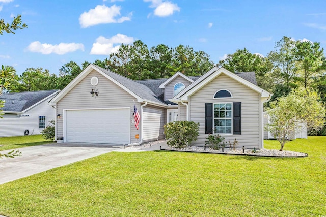 view of front of property with a front yard and a garage