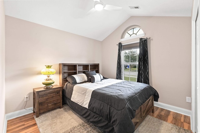 bedroom with vaulted ceiling, ceiling fan, and light hardwood / wood-style floors