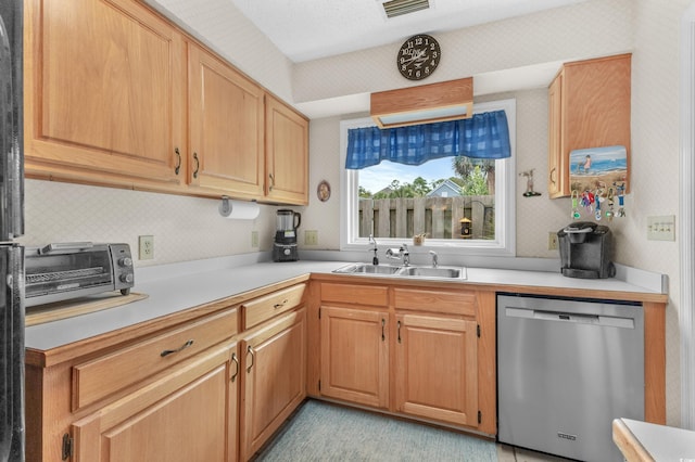 kitchen with dishwasher and sink