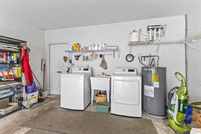 laundry room featuring sink, a textured ceiling, separate washer and dryer, and water heater