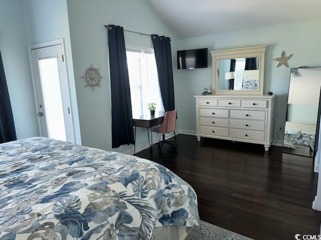 bedroom with lofted ceiling and dark hardwood / wood-style flooring