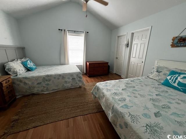 bedroom with wood-type flooring, vaulted ceiling, and ceiling fan