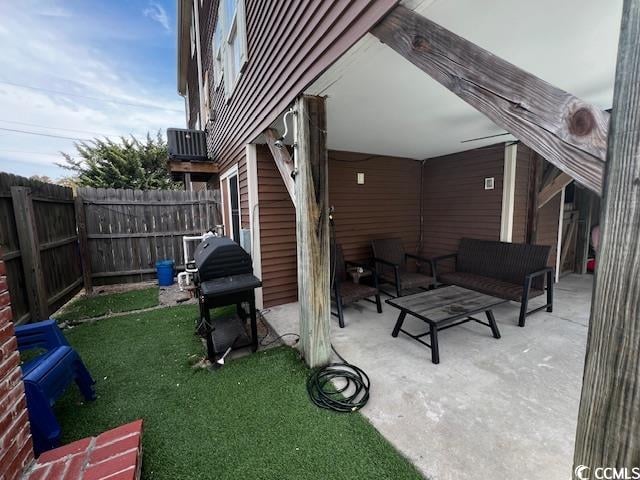 view of patio with cooling unit and a grill