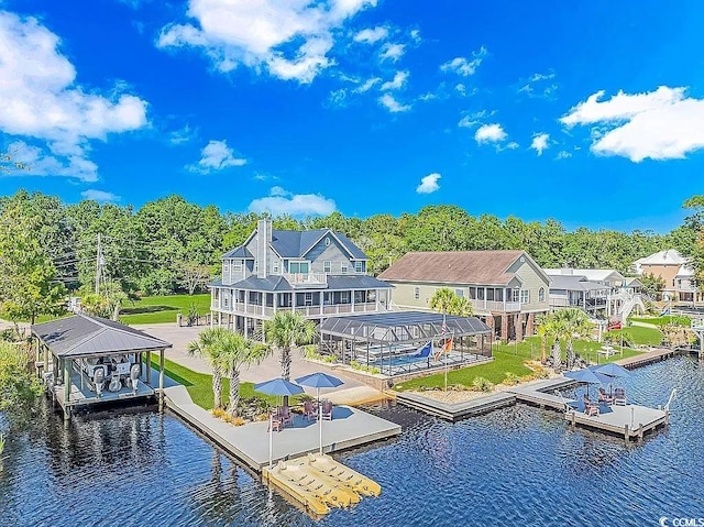 back of property featuring a water view