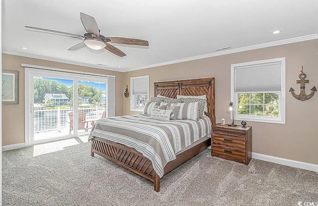 carpeted bedroom with ornamental molding, ceiling fan, multiple windows, and access to outside