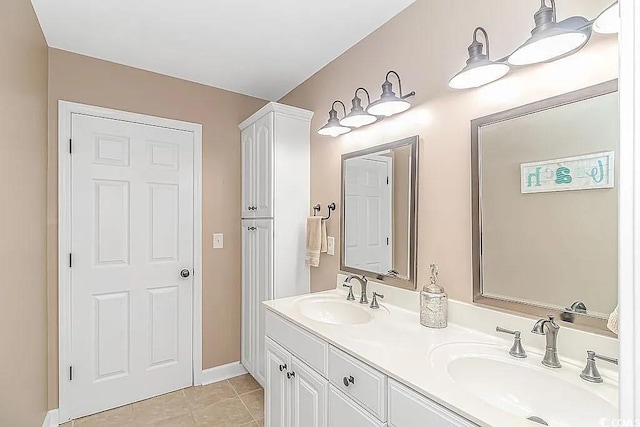 3815 Ed Smith Ave, Myrtle Beach, SC 29588 - bathroom with baseboards, tile patterned flooring, double vanity, and a sink