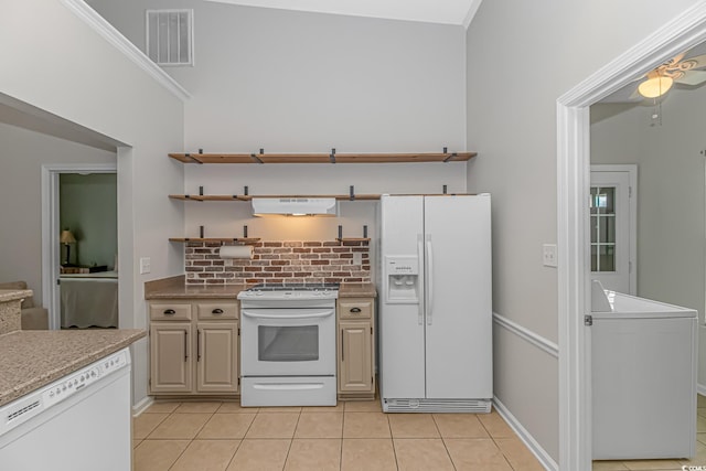 kitchen featuring backsplash, white appliances, extractor fan, light tile patterned floors, and lofted ceiling